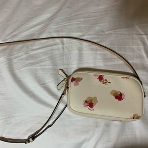 White and pink floral Coach purse